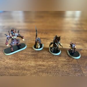 3D printed demon miniatures from a collection called "Reign in Hell"